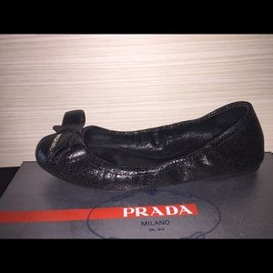 Black leather Prada flats